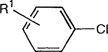 Reaction scheme showing the conversion of aryl chloride (Formula II) to Grignard reagent (Formula III) and finally to benzyl alcohol (Formula I) using magnesium and formaldehyde